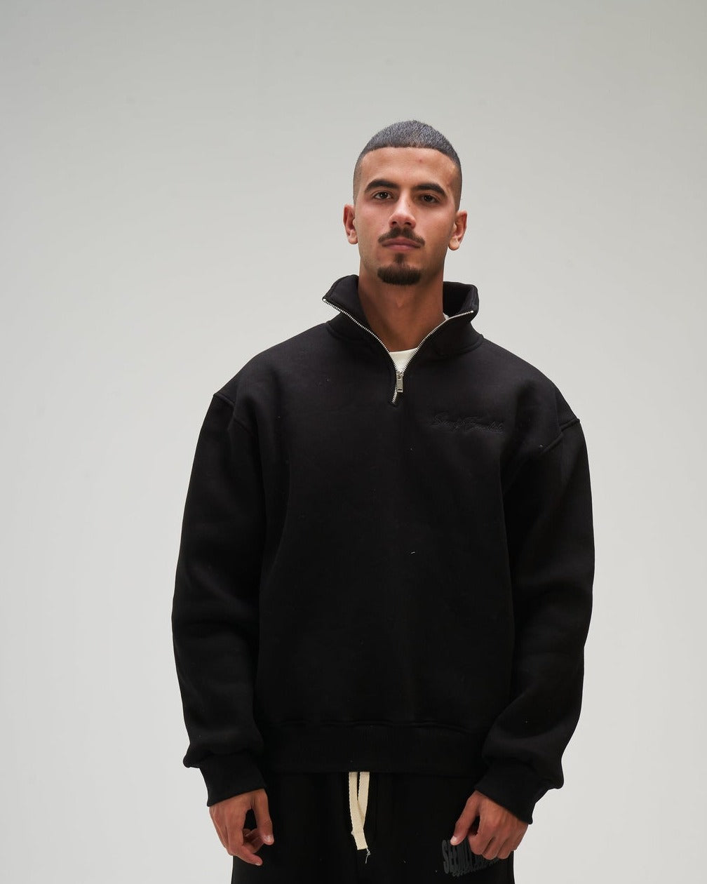 Men – Black Q-Zip – Seemly Essentials (cover)